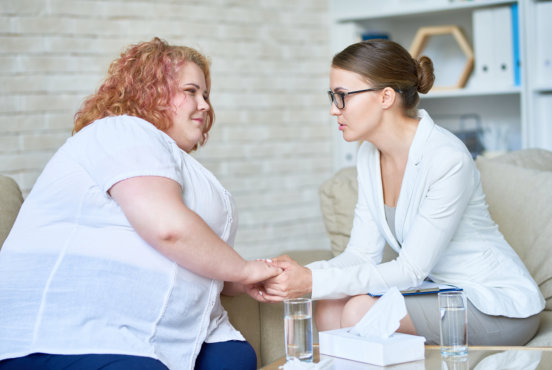 two adult lady talking